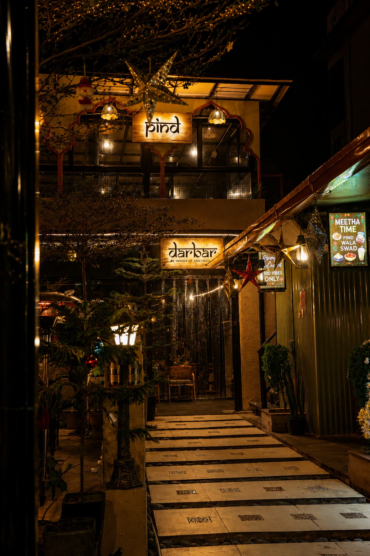 The lantern-lit walkway into the House
